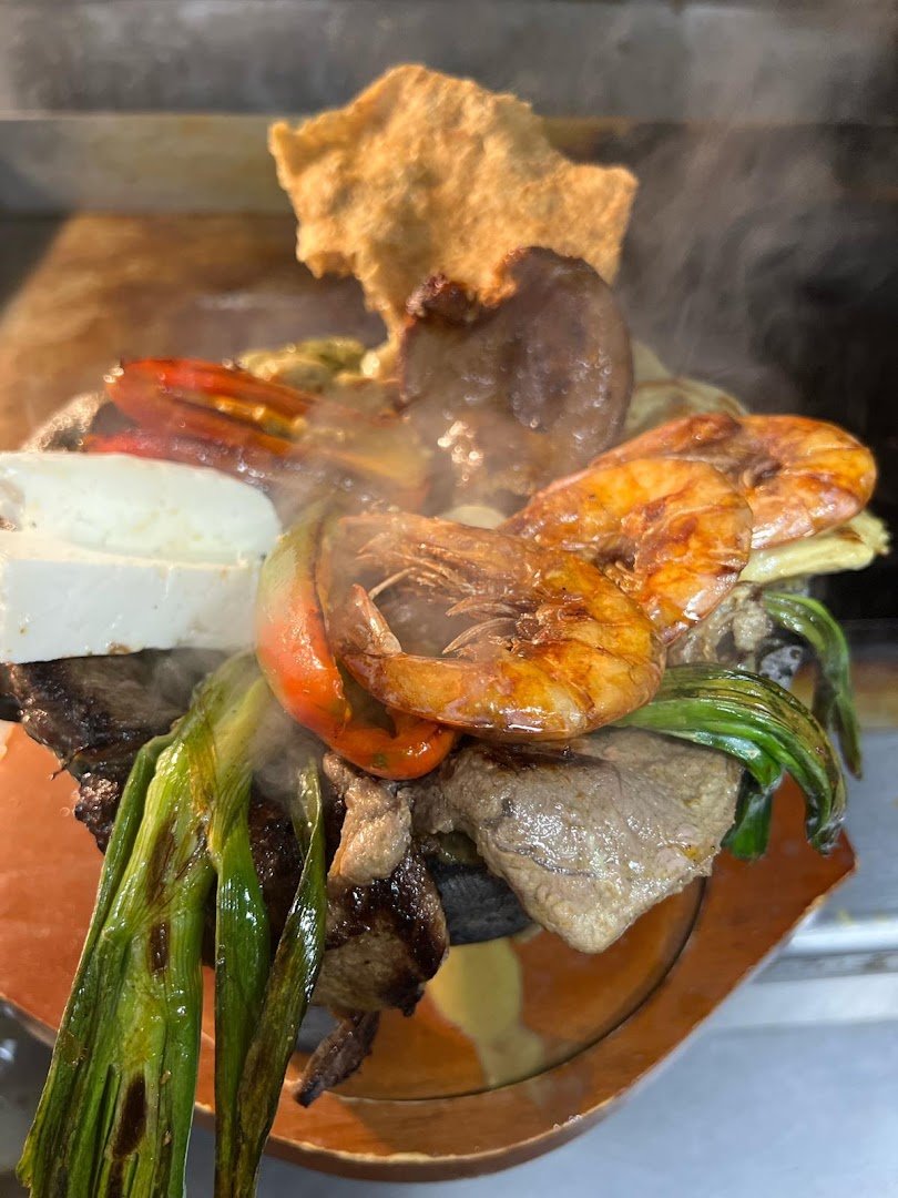 Mexican seafood dishes served in a bustling space.